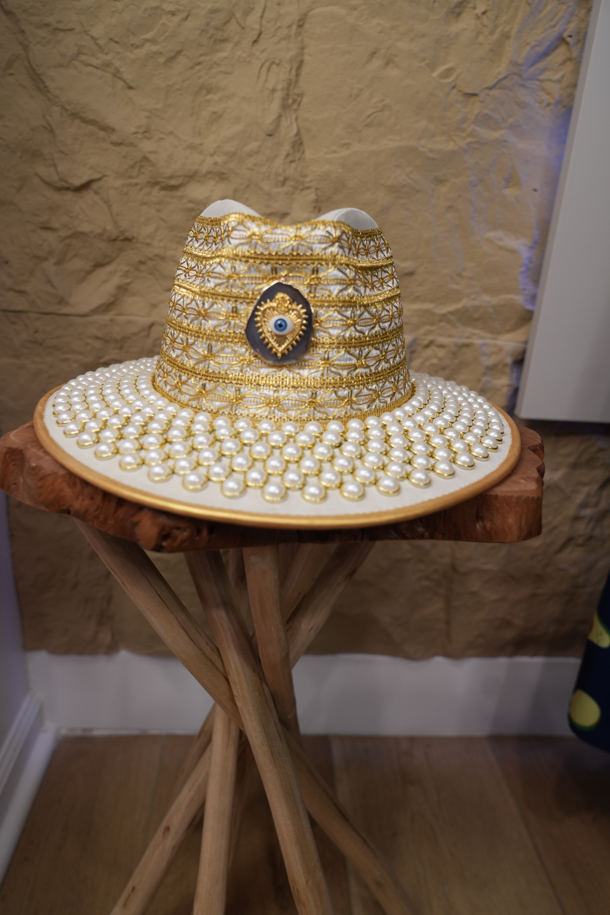 White hat with jewelry and pearls