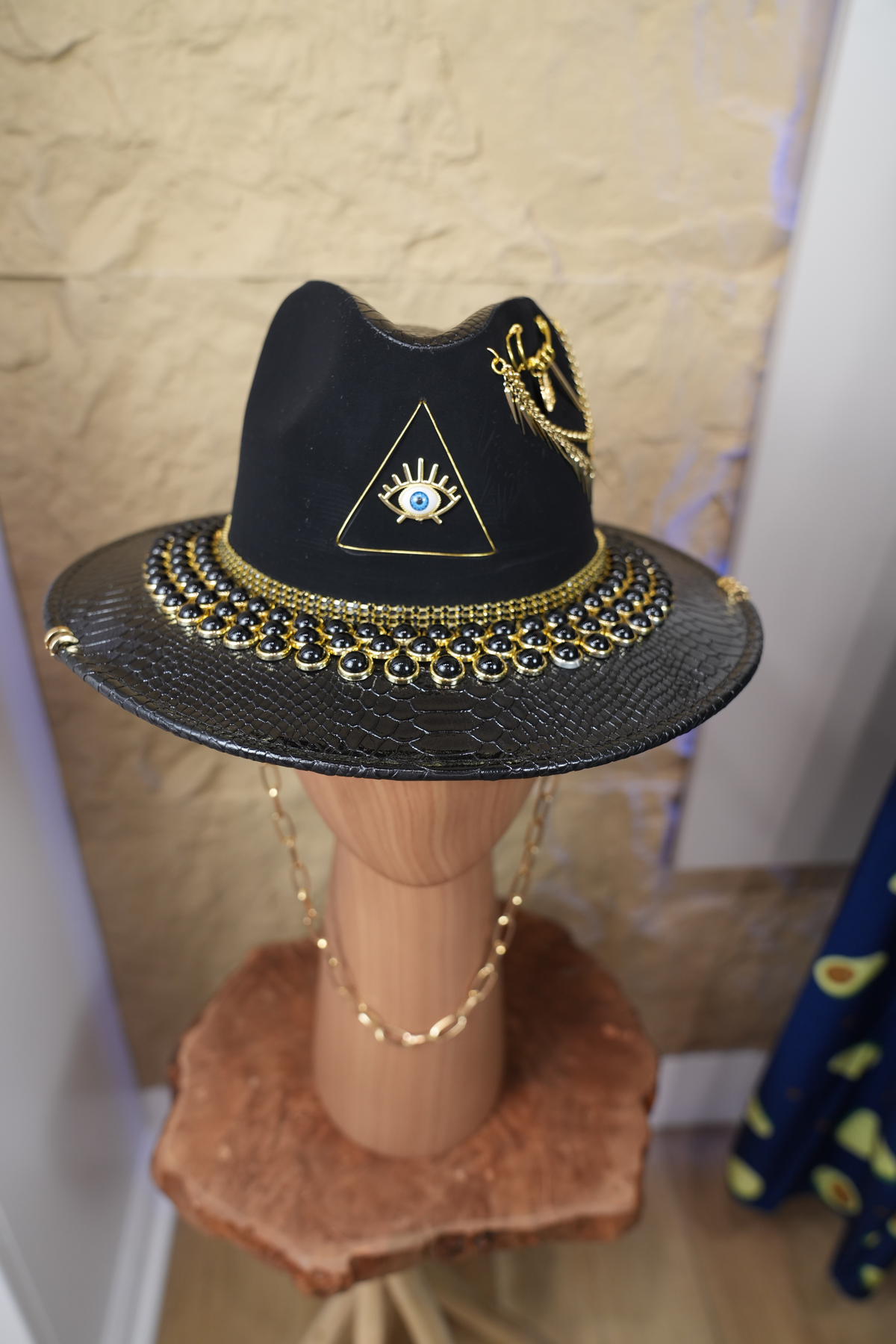 Black hat with jewelry and pearls