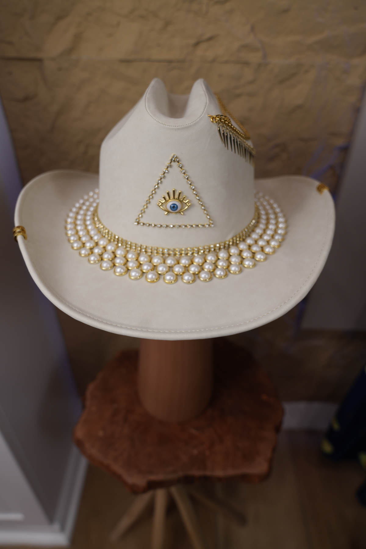 White hat with jewelry and pearls