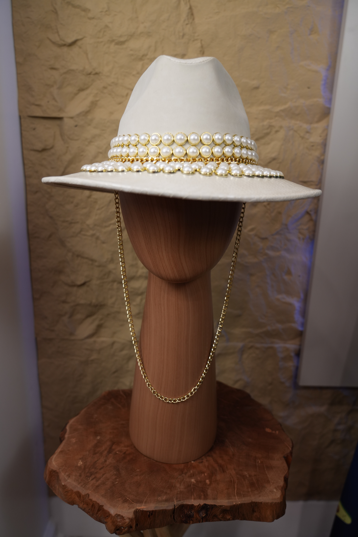 White hat with jewelry and pearls