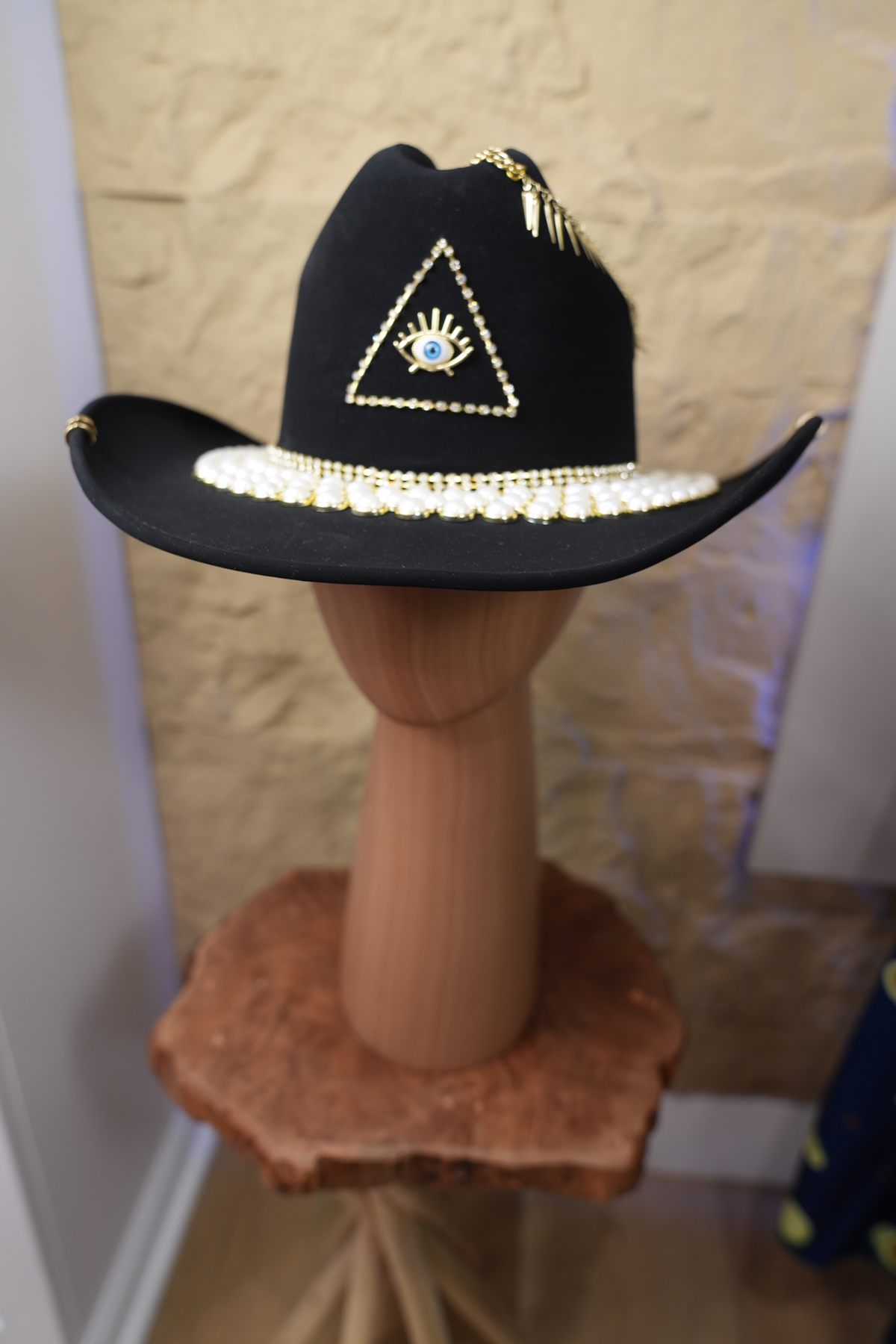 Black hat with jewelry and pearls