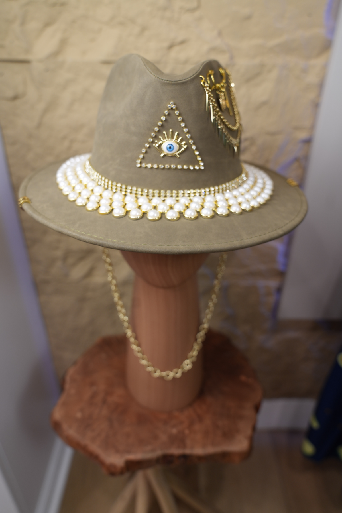 Grey hat with jewelry and pearls